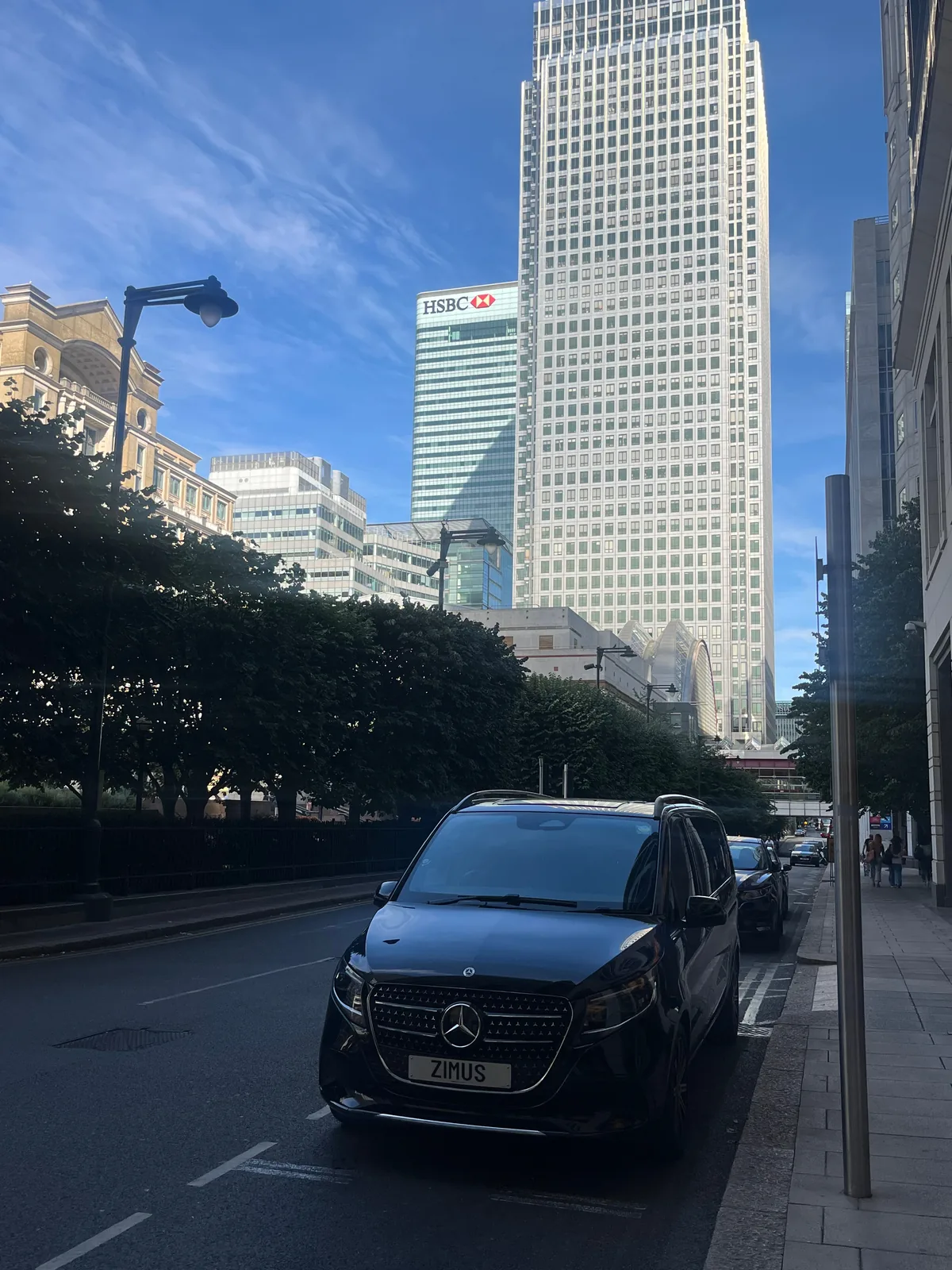 Mercedes-Benz V-Class on a Canary Wharf street with One Canada Square behind