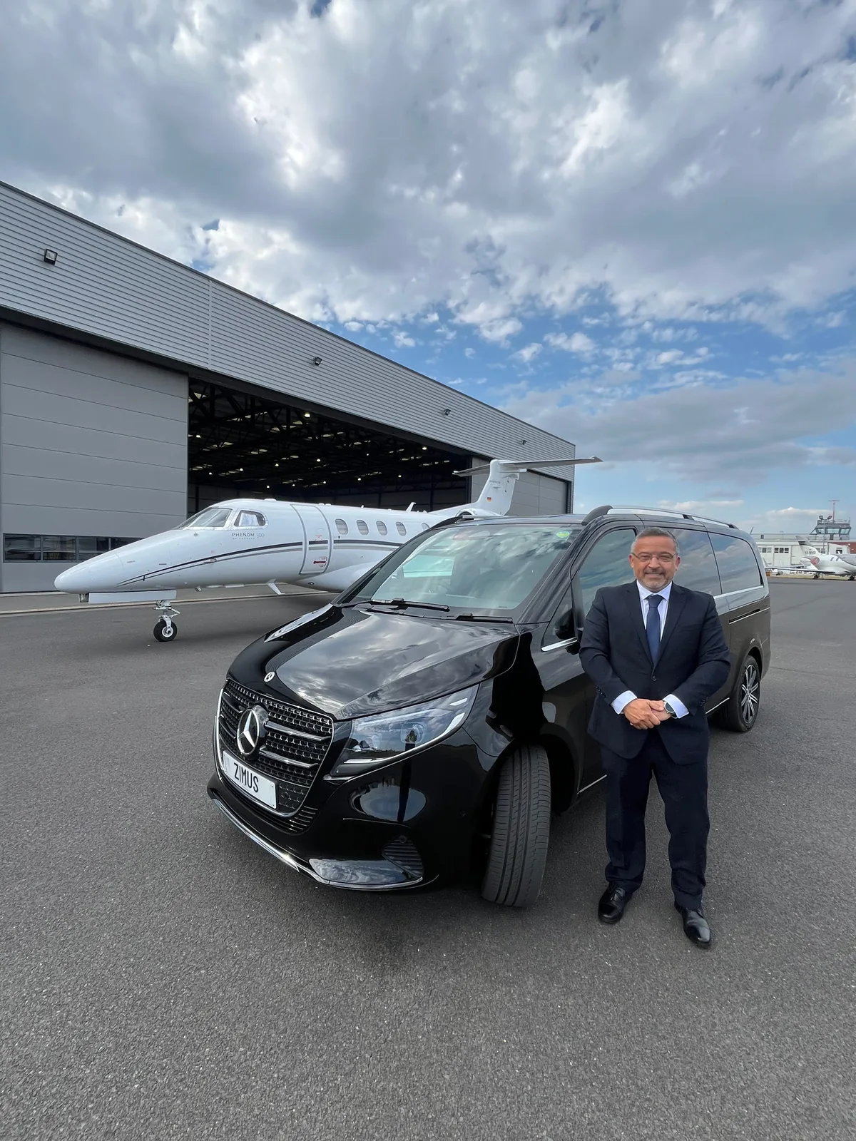 ZIMUS Mercedes-Benz V-Class beside a private aircraft